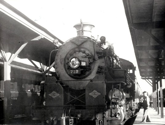 Texas & Pacific steam engine No. 712 at Jackson Street crossing at Union Station railroad depot, Alexandria, Louisiana